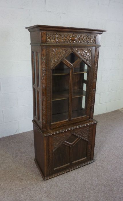 A small oak Jacobean style china cabinet, circa 1900, the top with a single glazed cabinet door, - Image 2 of 5