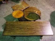 A small oak framed trestle table, modern, together with three other small occasional tables and a