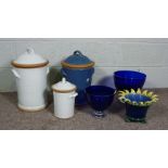 Two large stoneware covered kitchen jars, together with a similar smaller version, two large blue