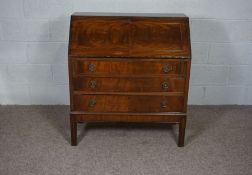 A George III style mahogany veneer bureau, 20th century reproduction, with fall front and three long