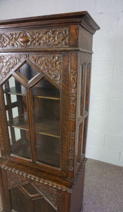 A small oak Jacobean style china cabinet, circa 1900, the top with a single glazed cabinet door, - Image 3 of 5