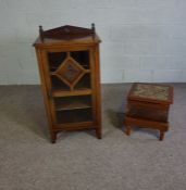 A late Victorian pier cabinet, circa 1890, with a glazed single door opening to three shelves;