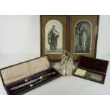 An Edwardian three piece carving set, with horn and ivory handles and silver collars, hallmarked