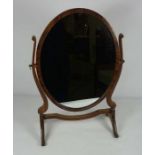 A 19th century swing oval toilet mirror, 60cm high