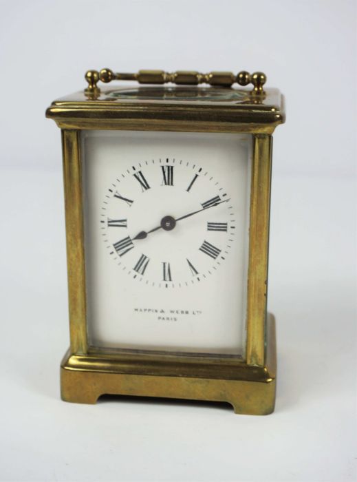 A small brass cased carriage clock, signed Mappin & Webb Ltd, Paris, in a standard plain four