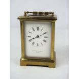 A small brass cased carriage clock, signed Mappin & Webb Ltd, Paris, in a standard plain four