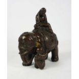 A Japanese bronze figure of an scholar riding an elephant, Meiji style, 15cm high, 13cm wide