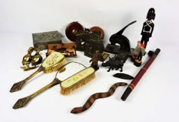 A tin box containing ephemera, including a pair of bookends, a gilt framed vanity set, assorted