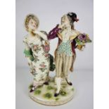 A Ludwisburg porcelain figure group of a lady and gallant, circa 1900-1910, hand painted, she