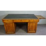 A Victorian mahogany partners desk, late 19th century, with a rectangular ‘leather’ inset top,