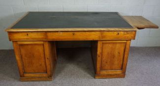A Victorian mahogany partners desk, late 19th century, with a rectangular ‘leather’ inset top,