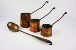 A graduated set of three Victorian copper, brass and wrought iron cider measures, together with a