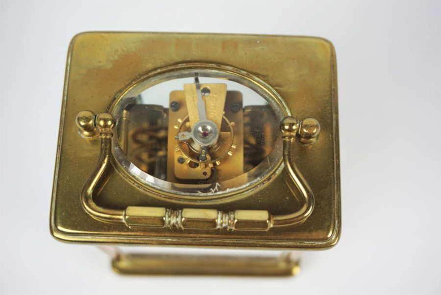 A small brass cased carriage clock, signed Mappin & Webb Ltd, Paris, in a standard plain four - Image 3 of 4