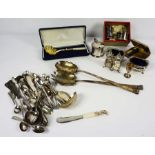 A quantity of assorted silver and silver plated flatware and related objects, including sugar tongs,