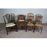 A group of assorted chairs, including a 19th century armchair, a caned tub chair, and three wheel