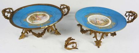 Two Sevres decorative porcelain plates with gilt metal mounts (one damaged), together with ten