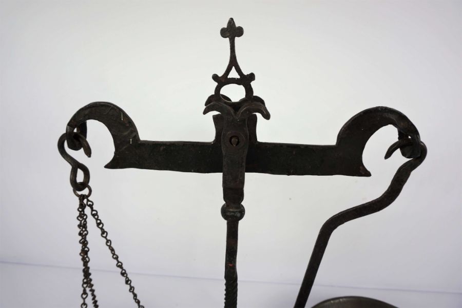 A wrought iron set of balance scales, 19th century, with nine assorted and graduated weights (10) - Image 6 of 6
