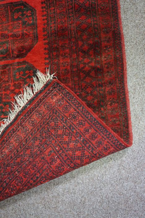 Three assorted rugs, 20th century, one with four medallions on a red ground (3) - Image 5 of 8