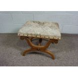 A Regency style X-framed footstool, with upholstered top, 53cm wide