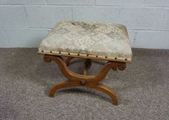 A Regency style X-framed footstool, with upholstered top, 53cm wide