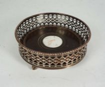 A Sheffield plate wine coaster, 19th century, of typical circular form, with deep fretwork cut sides