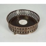 A Sheffield plate wine coaster, 19th century, of typical circular form, with deep fretwork cut sides