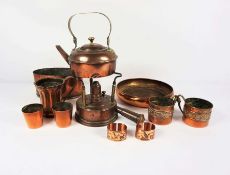 A quantity of assorted copperware, including an unusual large hip flask, spirit burner, kettle,