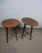Two mahogany ‘Holyrood’ folding occasional tables, circa 1900, one oval, one round, both with