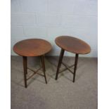 Two mahogany ‘Holyrood’ folding occasional tables, circa 1900, one oval, one round, both with