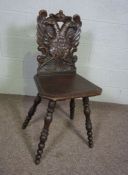 An oak hall chair, with crowned double eagle carved back, 19th century, by repute from Thurso