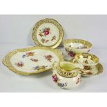 A Hammersley part tea service for twelve place settings, decorated with panels of flowers on a cream