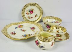 A Hammersley part tea service for twelve place settings, decorated with panels of flowers on a cream