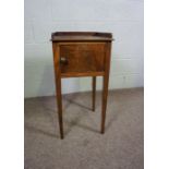 A small Victorian mahogany night table, with galleried top over a single pot cupboard with tapered