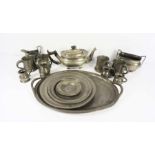 A collection of assorted pewter, including four small measures, four tankards, an oval tray, three