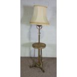 An unusual Victorian  brass and stoneware standard lamp stand, the decorative stoneware oil