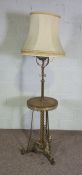 An unusual Victorian  brass and stoneware standard lamp stand, the decorative stoneware oil