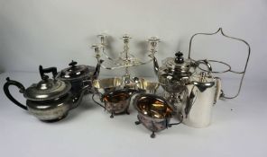 A box of assorted silver plate, including a three piece teaset, candelabrum and related (a lot)