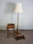 A mahogany standard lamp with tri-form base, together with a small carved table and a book rack (3)