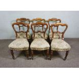 A set of six Victorian simulated rosewood framed dining chairs, circa 1870, the moulded backs over
