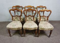 A set of six Victorian simulated rosewood framed dining chairs, circa 1870, the moulded backs over