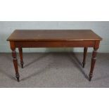 A mahogany console table, early 20th century, with rectangular top on four turned and tapered