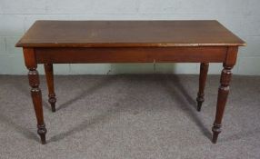 A mahogany console table, early 20th century, with rectangular top on four turned and tapered