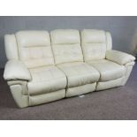 A modern white ‘leather’ settee, in three seat sections (set together or apart), 231cm long