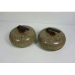 Two matched granite curling stones, with iron handles, 27cm diameter (2)