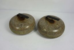 Two matched granite curling stones, with iron handles, 27cm diameter (2)