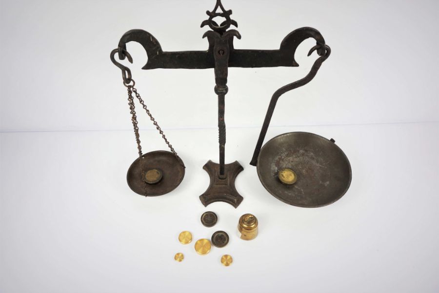 A wrought iron set of balance scales, 19th century, with nine assorted and graduated weights (10) - Image 3 of 6