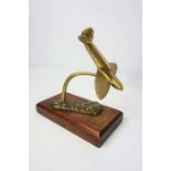 A small brass model of a ‘Spitfire’, possibly a car mascot, circa 1940/50, together with a selection