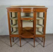 An Edwardian satinwoood side cabinet, circa 1910, with a brass galleried back, over a central