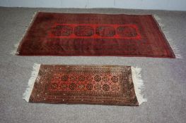 Three assorted rugs, 20th century, one with four medallions on a red ground (3)