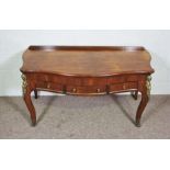 A Louis XVI style mahogany veneeered console table, 20th century reproduction, with serpentine top